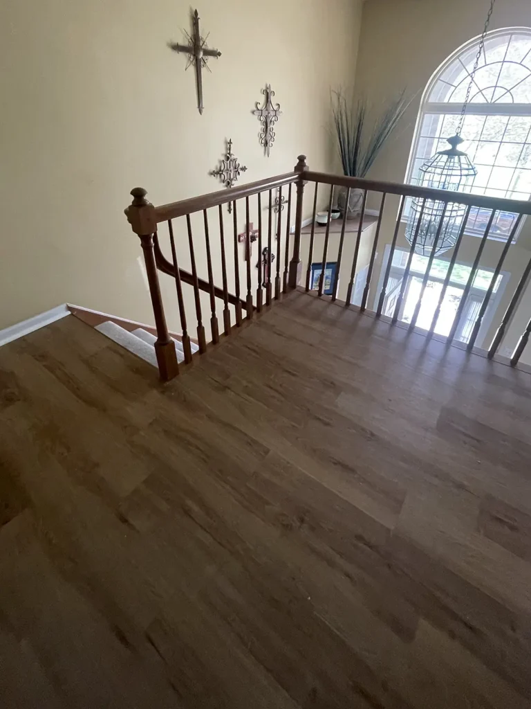 Luxury vinyl plank in an upstairs hallway, offering durability and style.